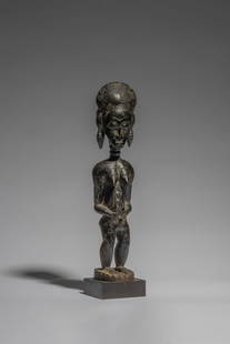 BAULE FEMALE FIGURE, IVORY COAST: BAULE FEMALE FIGURE, IVORY COAST asi usu wood 43.5 cm high Provenance Galerie Philippe Dodier, Avranches, 1968