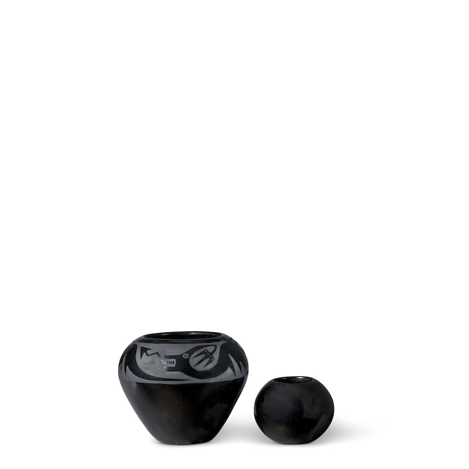 Two Maria Martinez blackware pottery jars: Two Maria Martinez blackware pottery jars Including: a Maria Martinez and Popovi Da (San Ildefonso Pueblo, [1887-1980] and [1923-1971]), polished blackware jar with an Avanyu encircling the shoulder,