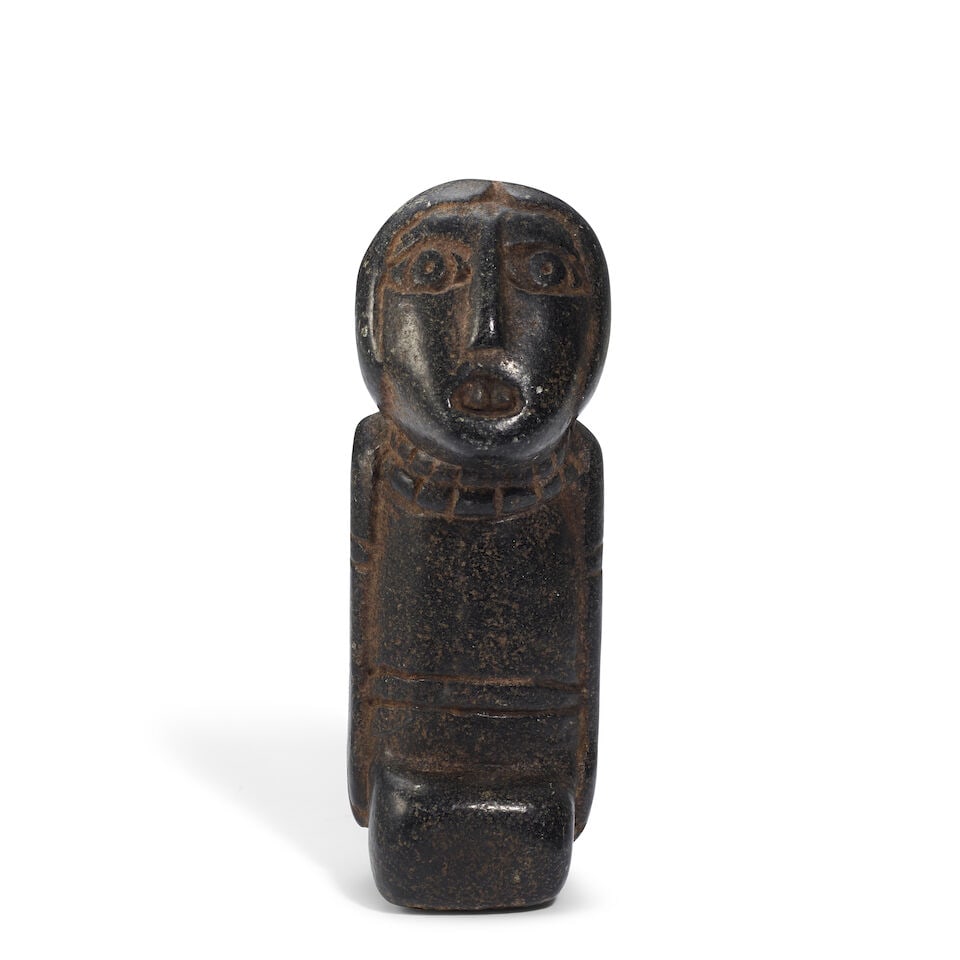 A Southeastern Woodlands or Great Lakes stone figural effigy pipe: A Southeastern Woodlands or Great Lakes stone figural effigy pipe Carved as a kneeling figure, mouth agape, with the bowl depicted as a bundle carried on the back. height 4 3/8in, width 2 1/2in Footno