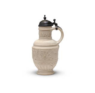 A Siegburg stoneware pweter-mounted jug (Zylinderhalskrug), probably by the workshop of Christia...: A Siegburg stoneware pweter-mounted jug (Zylinderhalskrug), probably by the workshop of Christian Knütgen, late 16th centuryDecorated in relief with dense Arabesque-style bands around the neck