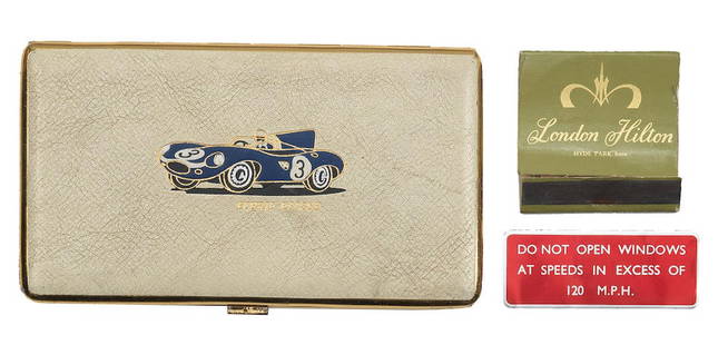 A rare Ecurie Ecosse cigarette case, 1957, ((3)): A rare Ecurie Ecosse cigarette case, 1957, cream leather cover embossed with image of 1957 Le Mans winning No.3 D-type Jaguar in Ecurie Ecosse livery, gilt metal, 14.5cm wide, together with a 120mph w