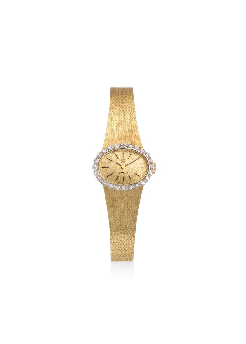 OMEGA. A 14K GOLD AND DIAMOND SET MANUAL WIND BRACELET WATCHRef: H7901-R, c. 1970s: OMEGA. A 14K GOLD AND DIAMOND SET MANUAL WIND BRACELET WATCH Reference: H7901-R Date: c. 1970s Movement: Cal. 1070, 17-jewel manual wind, no. 40'233'022 Dial: Champagne Case: Oval, snap on case back,
