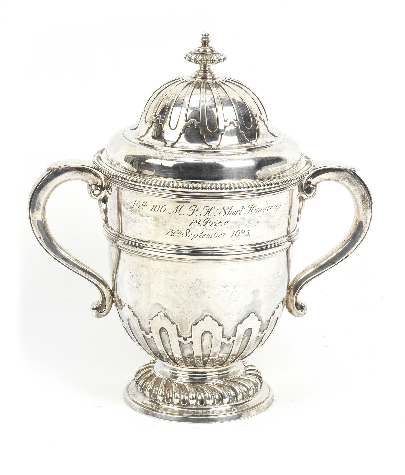 A BARC Brooklands 1925 100MPH Short Handicap 1st place sterling silver trophy, ((2)): A BARC Brooklands 1925 100MPH Short Handicap 1st place sterling silver trophy, George V twin-handled trophy with lid and finial by Charles & Richard Comyns, hallmarked London, 1925, inscribed to face