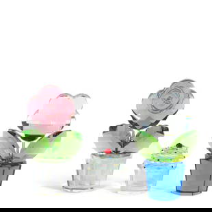 TWO SWAROVSKI CRYSTAL 'HAPPY FLOWERS' FIGURES2002-2012: TWO SWAROVSKI CRYSTAL 'HAPPY FLOWERS' FIGURES 2002-2012 Comprising a clear and sapphire flower example and a pink rose example designed by Eva Maria Ried from the Swarovski Crystal Moments collection,