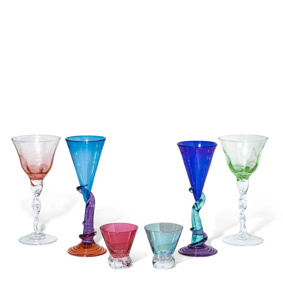 A GROUP OF CLEAR AND COLORED GLASS STEMWARELate 20th/21st century: A GROUP OF CLEAR AND COLORED GLASS STEMWARE Late 20th/21st century Comprising four Alex Brand multicolored flutes, six Abigails Adriana clear and colored twisted stem wine glasses, and four clear and