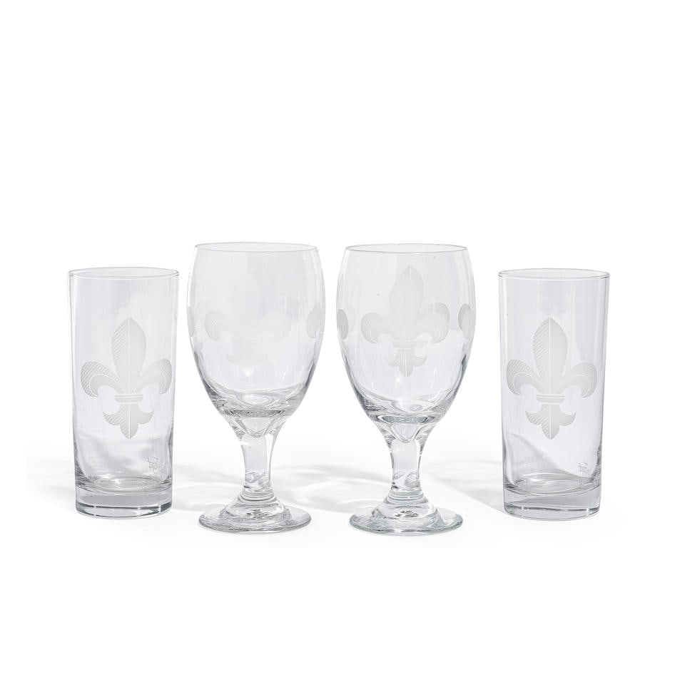 A GROUP OF MIGNON FAGET GLASS STEMWARE21st century: A GROUP OF MIGNON FAGET GLASS STEMWARE 21st century In the Fleur de Lis pattern, comprising six wine goblets and four highball glasses, each with acid etched factory mark. (10) height of wine goblets
