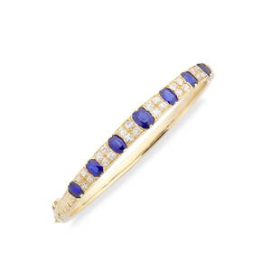SAPPHIRE AND DIAMOND GOLD BANGLE,: SAPPHIRE AND DIAMOND GOLD BANGLE, LATE 19TH CENTURY Set with alternating oval-shaped sapphires and old cushion-shaped diamonds, to a carved scroll gallery, diamonds approx. 1.30cts total, inner circum