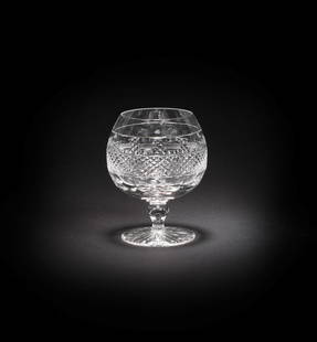 Twelve cut-glass brandy glasses Made by Cumbria Crystal in the Grasmere design, probably acquire...: Twelve cut-glass brandy glasses Made by Cumbria Crystal in the Grasmere design, probably acquired from Season 2 onwards With cut-hob-nail banded decoration 12cm high (12) This lot is subject to the fo