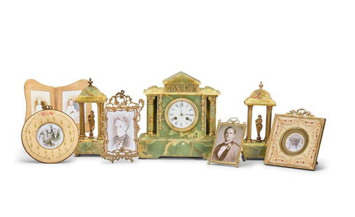 Library: A selection of set dressing acquired by the Prop Department Various Seasons and Episode...: Library: A selection of set dressing acquired by the Prop Department Various Seasons and Episodes To include: a French green onyx and gilt metal mounted clock garniture, in the Neo-Classical taste, th