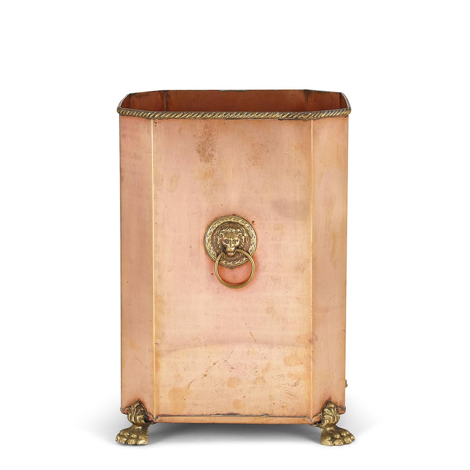 AN ENGLISH BRASS AND COPPER CACHEPOTCirca 1900: AN ENGLISH BRASS AND COPPER CACHEPOT Circa 1900 height 12 7/8in (32.7cm); width 9in (23cm) square Footnotes: Condition reports are not provided in catalog descriptions. The absence of a condition repo
