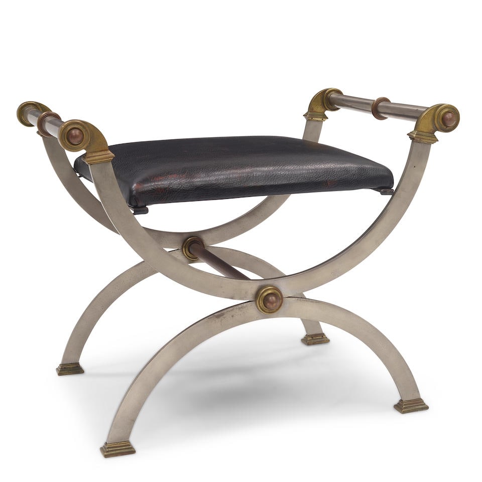 AN EMPIRE STYLE CURULE GILT AND PATINATED METAL MOUNTED FAUX LEATHER BENCHIn the style of Maison... (1 of 4)