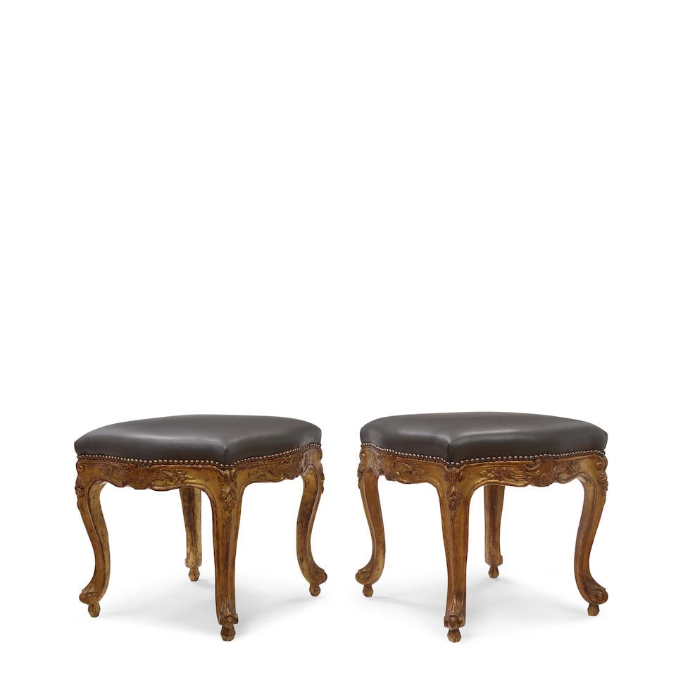 A PAIR OF LOUIS XV STYLE CARVED GILTWOOD FAUX LEATHER STOOLS (1 of 2)