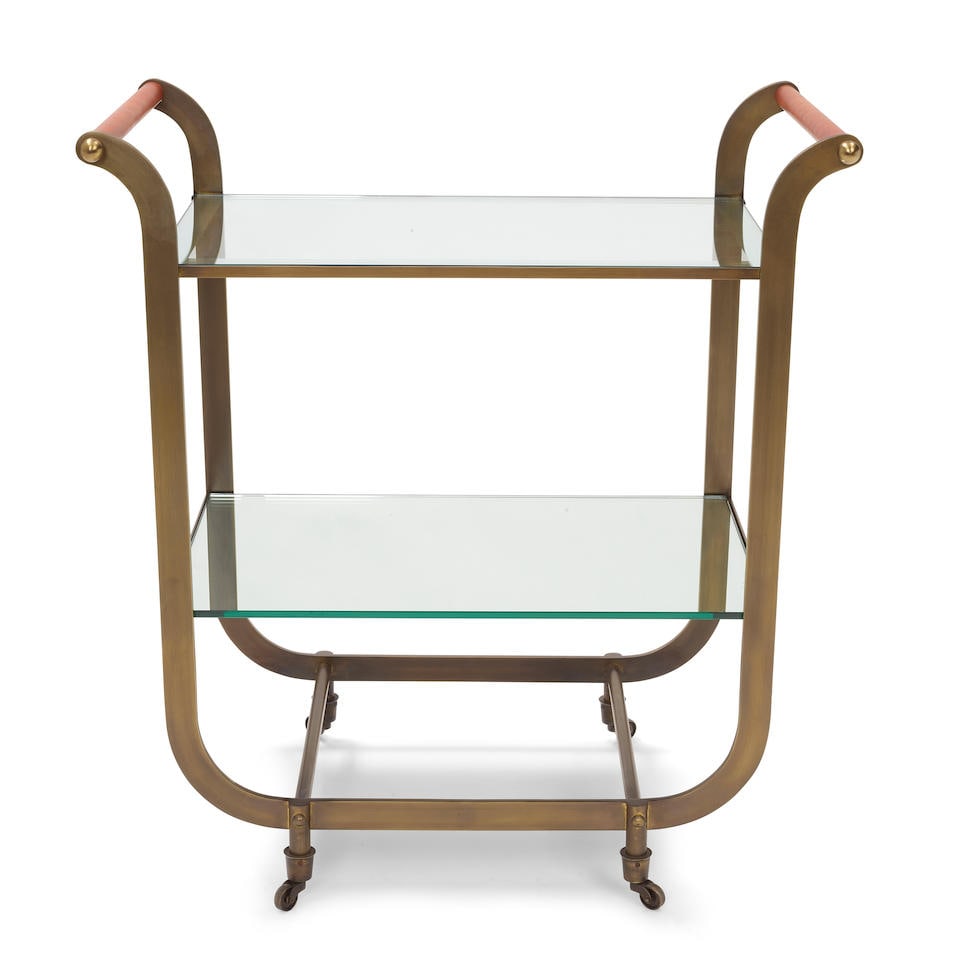 CARL AUBOCK (1900-1957) Bar Cartpatinated brass, glass, with later top-stitched leather endsheig... (1 of 3)