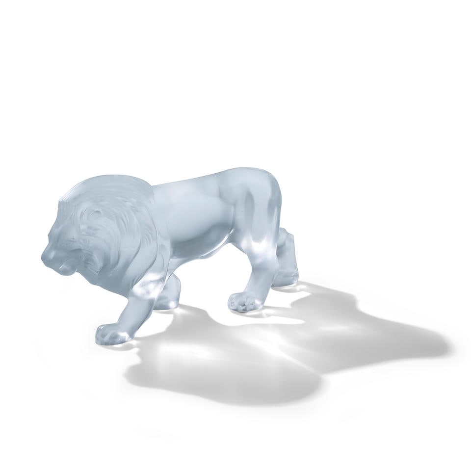 A LALIQUE GLASS FIGURE OF A LION: A LALIQUE GLASS FIGURE OF A LION Lot to be sold without reserve. This lot is subject to the following lot symbols: ¤ 'Bonhams' owns the 'Lot' either wholly or partially or may otherwise have an e
