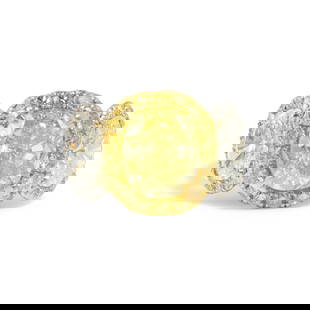 A PLATINUM, 18K GOLD, FANCY YELLOW DIAMOND, COLORED DIAMOND AND DIAMOND RING: A PLATINUM, 18K GOLD, FANCY YELLOW DIAMOND, COLORED DIAMOND AND DIAMOND RING Highlighting a cushion modified brilliant-cut Fancy Yellow diamond weighing 5.54 carats, in a surround of round diamonds of