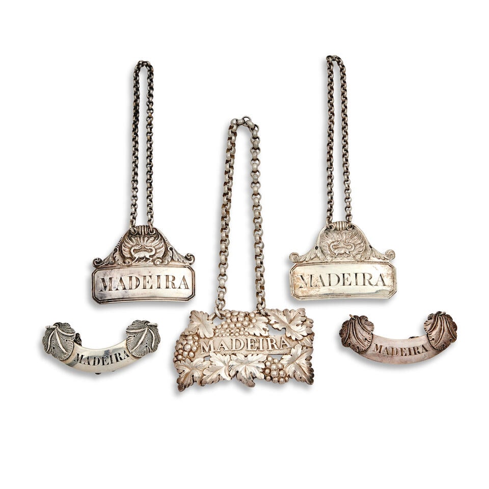 A collection of twelve Scottish silver MADEIRA labels predominately Glasgow (12): A collection of twelve Scottish silver MADEIRA labels predominately Glasgow Comprising: A Victorian label, David McDonald, 1837 rectangular with cut corners and thread borders, the top with cast with