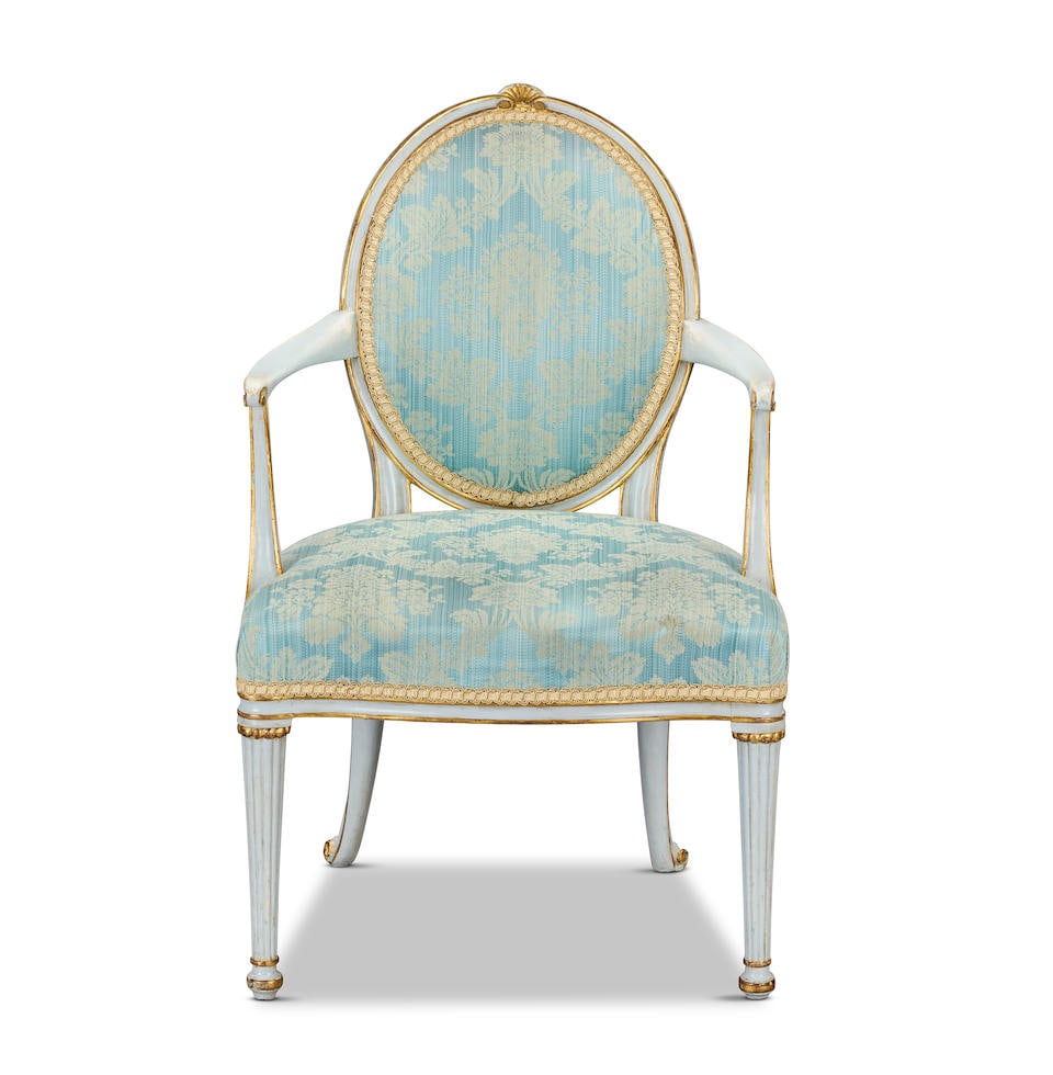 A George III painted and parcel gilt open armchair attributed to Thomas Chippendale the Younger ...: A George III painted and parcel gilt open armchair attributed to Thomas Chippendale the Younger (d. 1822) 1776-1780 With channelled frames, the oval back headed by a palmflower cresting, with scrolled