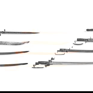 FOUR SPANISH COLONIAL SWORDS,: FOUR SPANISH COLONIAL SWORDS, 19th century. Three cutlasses with horn, iron and/or wood grips and curved single-edge blades; and a short sword with brass cross guard and horn grip. Overall lg. 39 1/2