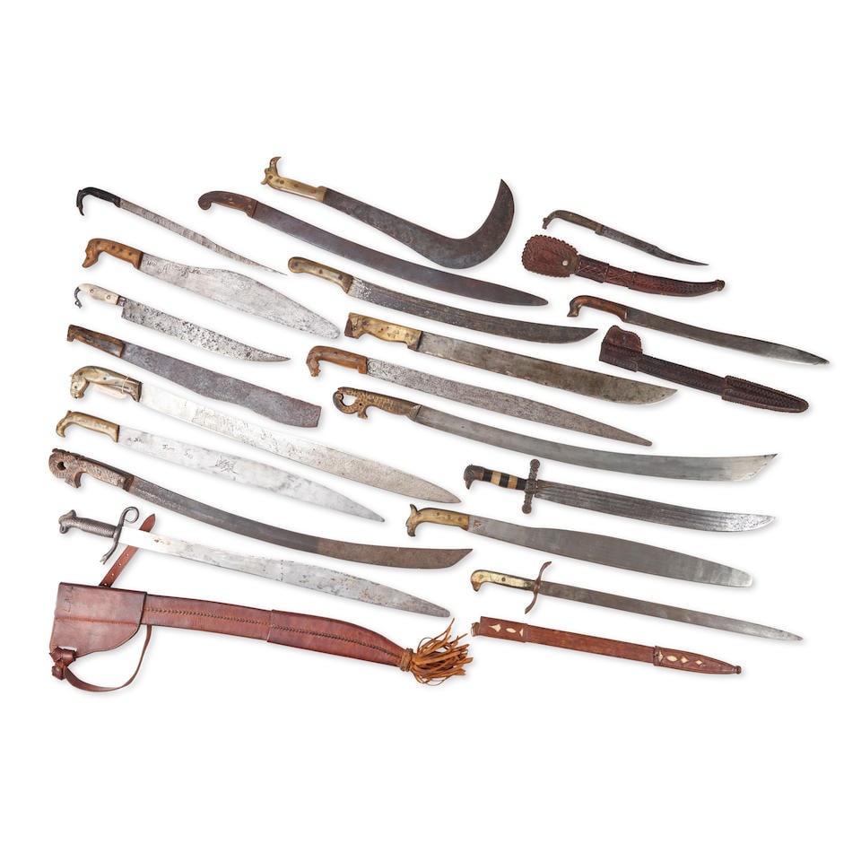 NINETEEN 19TH AND EARLY 20TH CENTURY MEXICAN MACHETES AND KNIVES.: NINETEEN 19TH AND EARLY 20TH CENTURY MEXICAN MACHETES AND KNIVES. Most with carved horn figural handles, four with leather scabbards. Overall lg. to 33 in. For further information on this lot please v