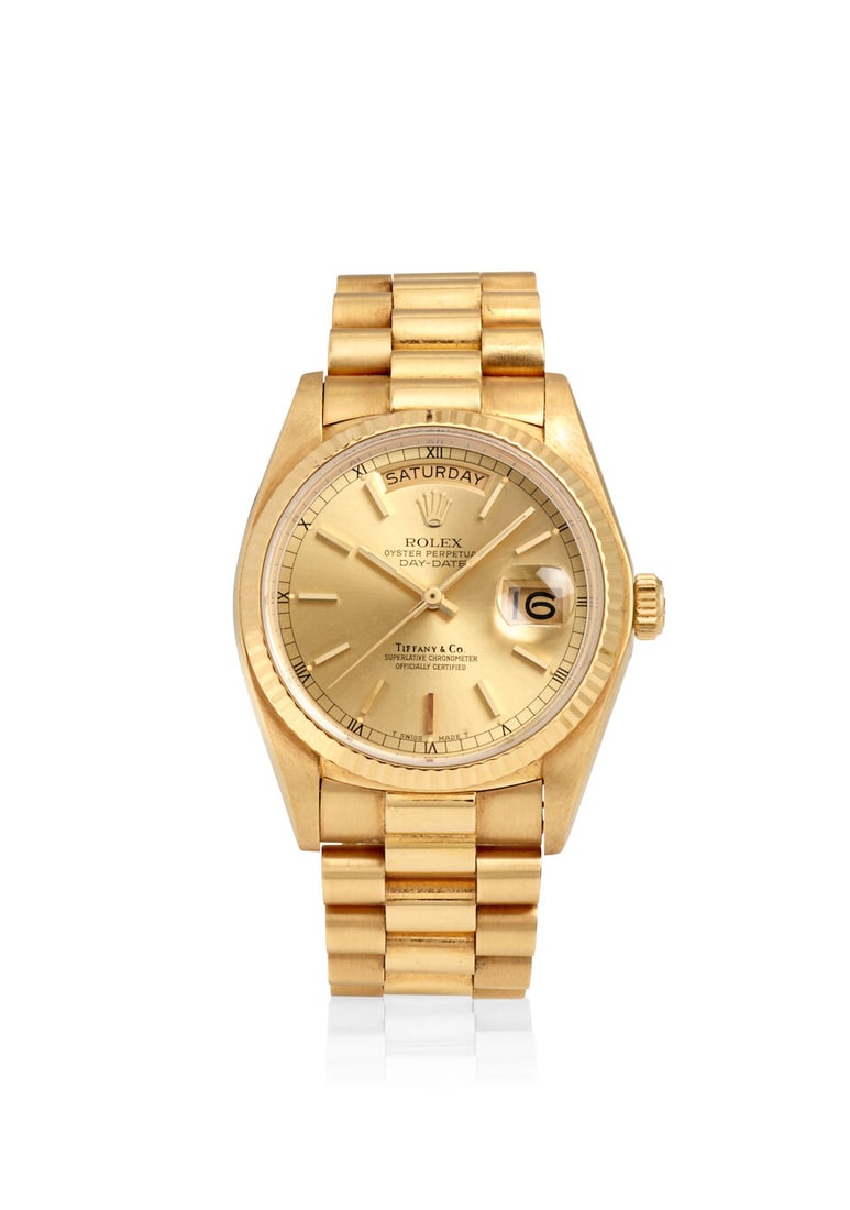 ROLEX, RETAILED BY TIFFANY & CO. A FINE 18K GOLD AUTOMATIC CALENDAR BRACELET WATCH Day-Date, Ref... (1 of 2)