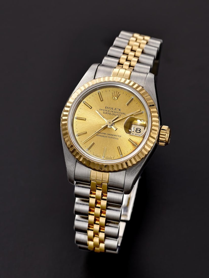 ROLEX | DATEJUST, REF.69173, A YELLOW GOLD AND STAINLESS STEEL BRACELET WATCH WITH DATE, CIRCA 1990: ROLEX | DATEJUST, REF.69173, A YELLOW GOLD AND STAINLESS STEEL BRACELET WATCH WITH DATE, CIRCA 1990 Case No: E689602 Calibre: 2135, automatic, signed Dial: Sunburst champagne, signed Case: 26mm, 18k y