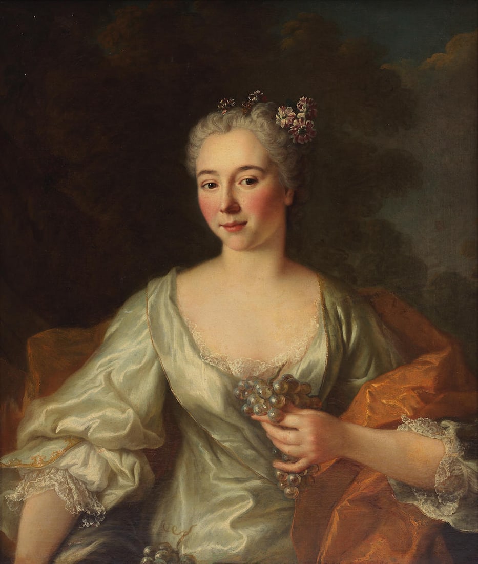 Attributed to Robert Levrac-Tournières (Caen 1667-1752) Portrait of a lady, half-length, in...: Attributed to Robert Levrac-Tournières (Caen 1667-1752) Portrait of a lady, half-length, in a white satin dress, holding a bunch of grapes oil on canvas 76 x 62.1cm (29 15/16 x 24 7/16in). framed