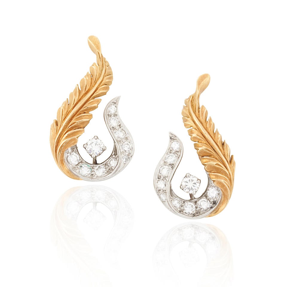 MCTEIGUE & CO.: A PAIR OF 18K GOLD, PLATINUM, AND DIAMOND EARCLIPS: MCTEIGUE & CO.: A PAIR OF 18K GOLD, PLATINUM, AND DIAMOND EARCLIPS With foliate motifs, set with full-cut diamonds, approximate total weight 0.90 carats, weight 5.5 dwt, maker's mark for McTeigue & C
