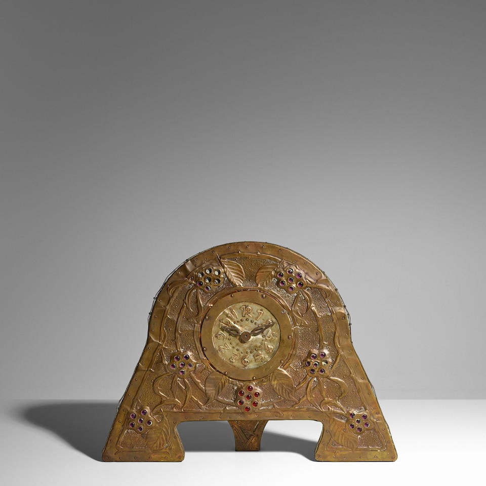 ALFRED DAGUET (1875-1942) Mantel Clock1903mahogany, hammered sheet brass, applied with polychrom...: ALFRED DAGUET (1875-1942) Mantel Clock 1903 mahogany, hammered sheet brass, applied with polychrome glass cabochons, hammered mark 'ALFRED DAGUET 03' height 16in (41cm); width 9in (23cm) Footnotes: Li