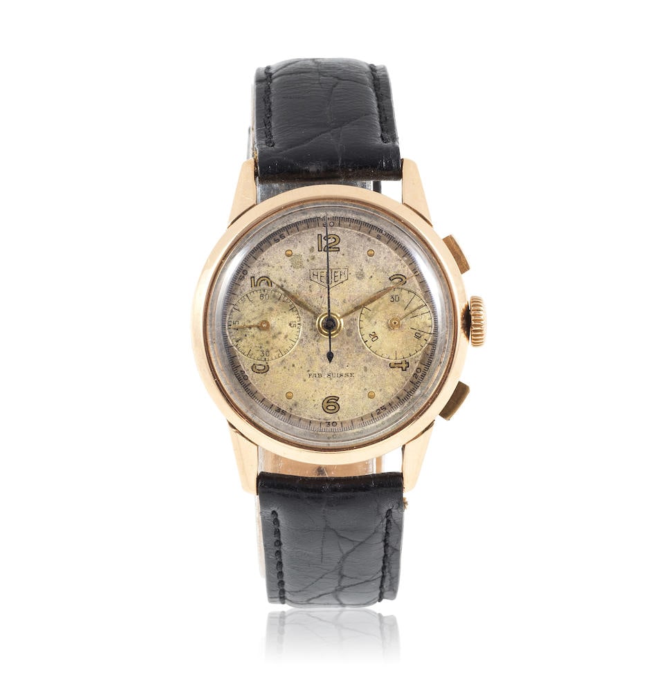 Heuer. An 18K gold manual wind chronograph wristwatch Heuer. Chronographe bracelet en or jaune 1... (1 of 5)