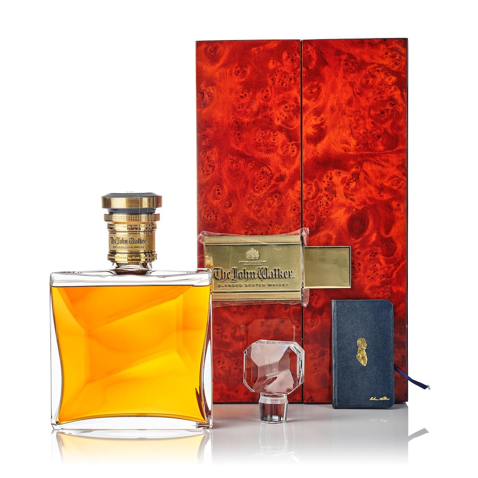 John Walker Baccarat Crystal Decanter (1x 700ml): John Walker Baccarat Crystal Decanter (1x 700ml) Region: Scotland Capsule: scuffed plastic capsule seal Label: engraved neck label with paint at the back Packaging: in scratched lacquered wood case wi