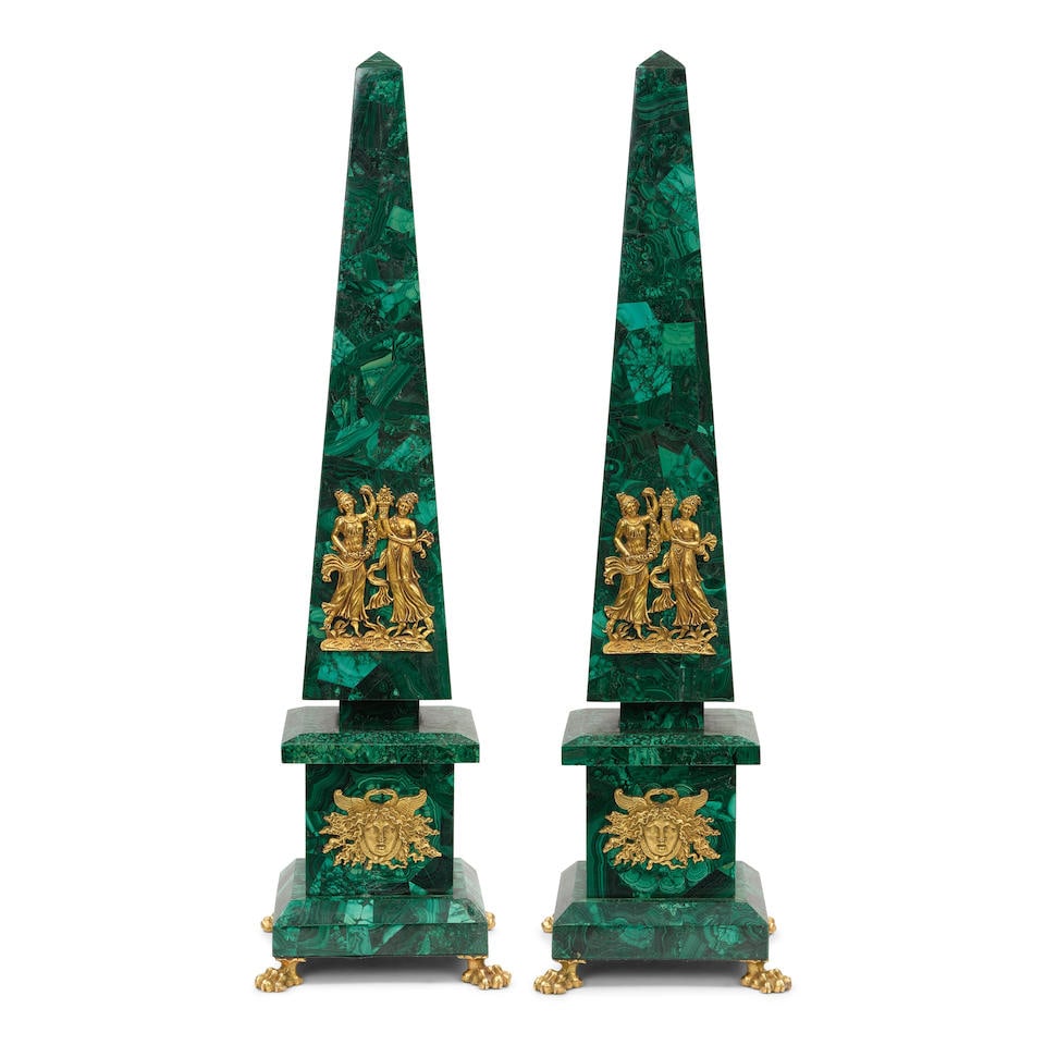 A PAIR OF NEOCLASSICAL STYLE GILT BRONZE MOUNTED MALACHITE OBELISKS20th century: A PAIR OF NEOCLASSICAL STYLE GILT BRONZE MOUNTED MALACHITE OBELISKS 20th century height 29 1/2in (74.7cm); width 8in (20.3cm); depth 8in (20.3cm) Footnotes: Condition reports are not provided in catal