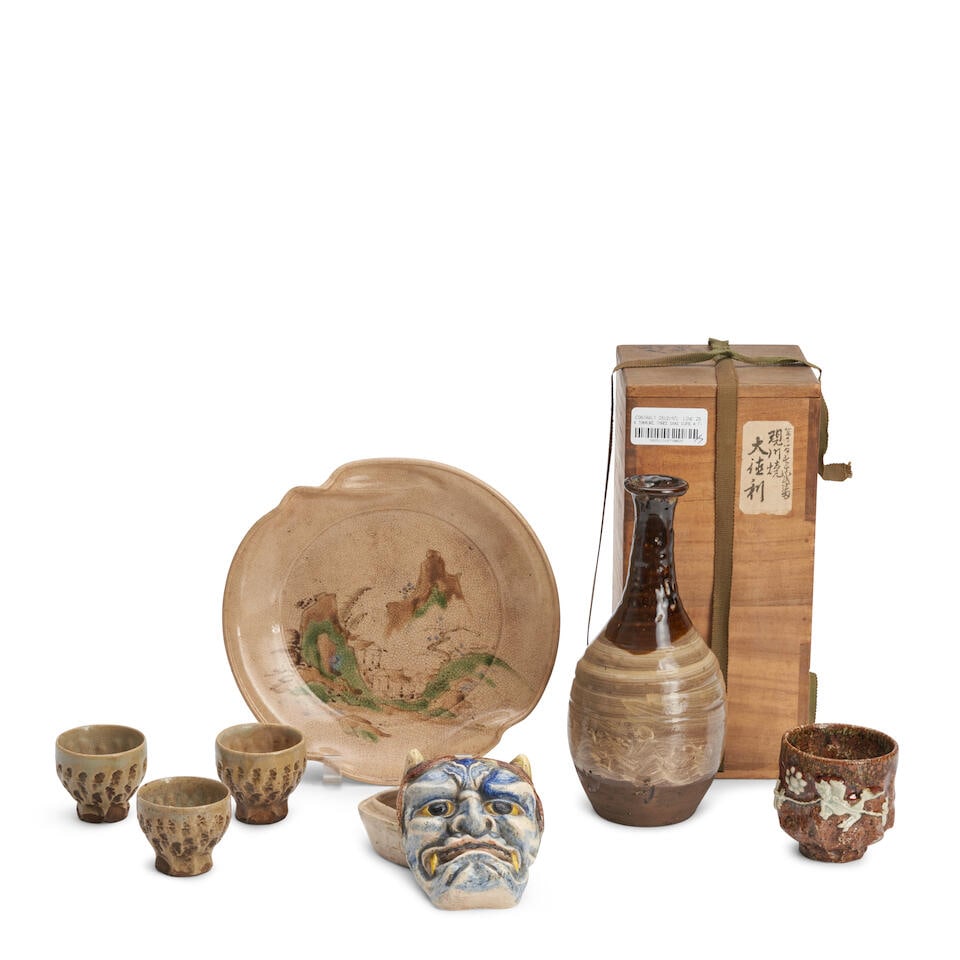 A TOKKURI, THREE SAKE CUPS, A TEA CUP, A COVERED BOX, AND AN EARTHENWARE DISH Taisho (1912-1926)...