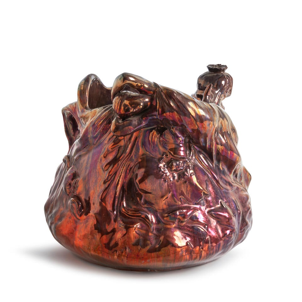 ART NOUVEAU FIGURAL JARDINIERE ATTRIBUTED TO FREDERIC DANTON France, c. 1900, iridescent glazed ...: ART NOUVEAU FIGURAL JARDINIERE ATTRIBUTED TO FREDERIC DANTON France, c. 1900, iridescent glazed earthenware, unmarked, ht. 11 1/4, dia. 12 3/4 in. For further information on this lot please visit Bonh