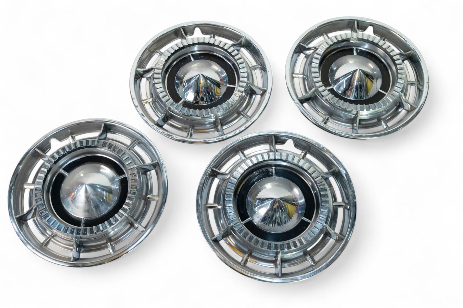 A set of four, 1960 Buick Invicta hubcap,: A set of four, 1960 Buick Invicta hubcap, mostly in good order, 15' diameter. (4) Lot to be sold without reserve. This lot is subject to the following lot symbols: ¤ ¤ Unless indicated by th