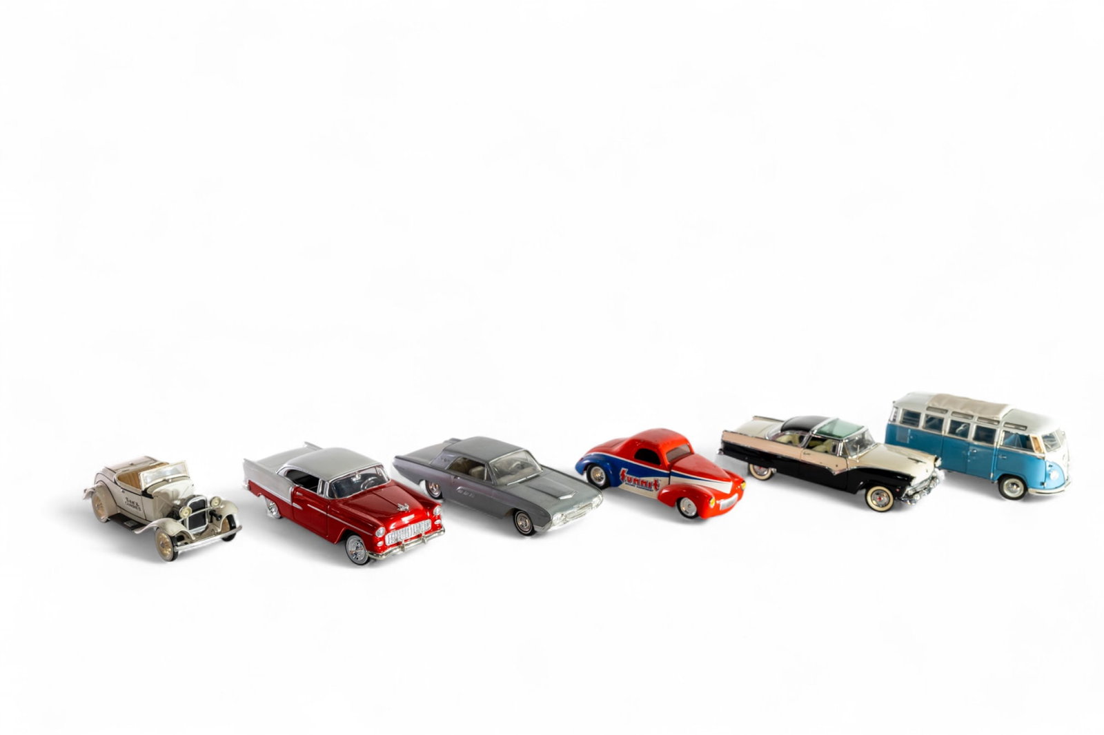 A collection of 1:24 scale model cars from the 1950s and 1960s,: A collection of 1:24 scale model cars from the 1950s and 1960s, diecast, comprised of a 1955 Chevy Bel-Air, 1955 Ford Fairlane by Danbury Mint, 1962 Volkswagen Bus, Summit racing hot rod, See's candie
