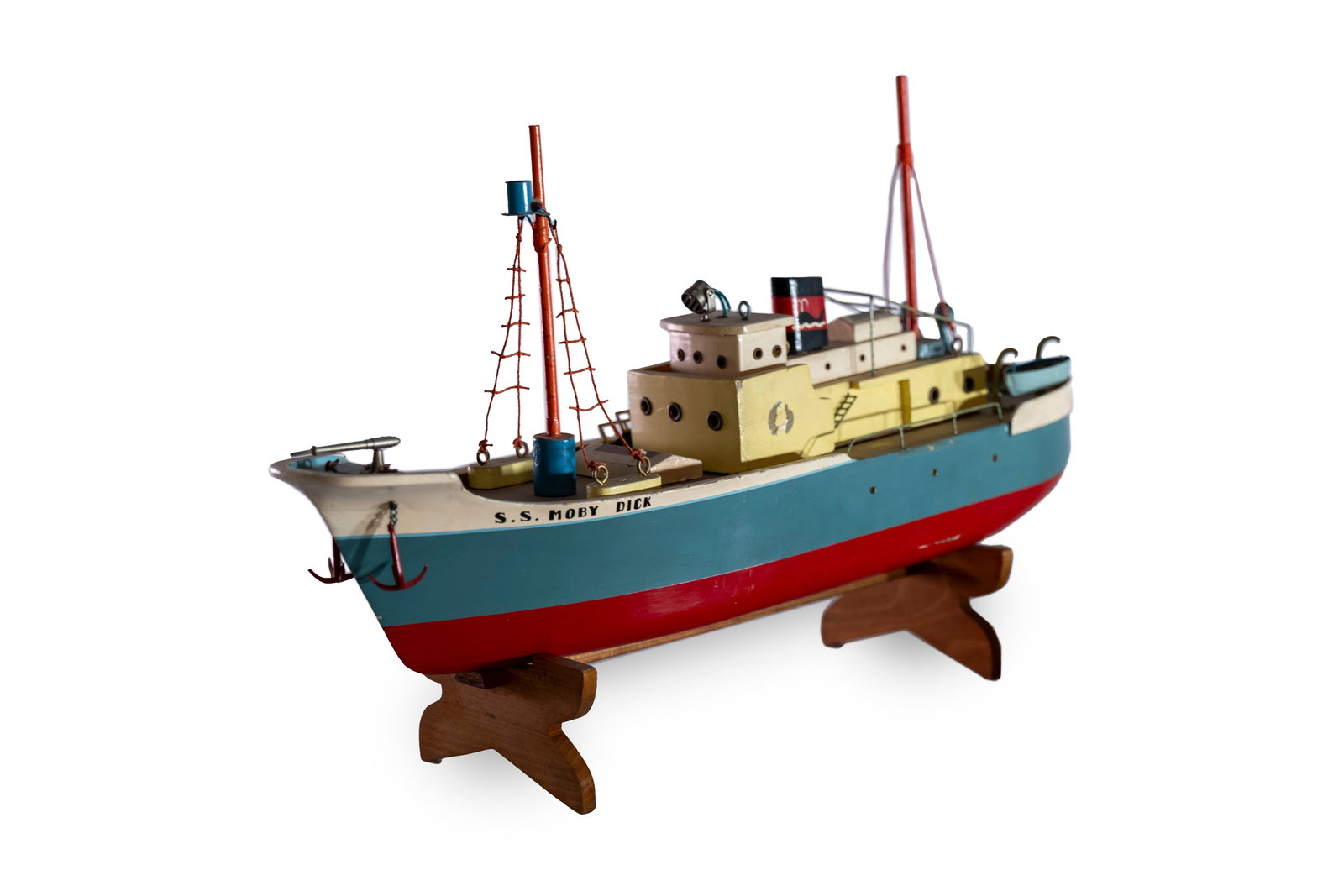 A Pre-War Japanese battery operated 'S.S. Moby Dick' boat,: A Pre-War Japanese battery operated 'S.S. Moby Dick' boat, wooden construction, hand painted, some signs of age in paint, missing a life raft on port side, mostly in good order, together with wooden s