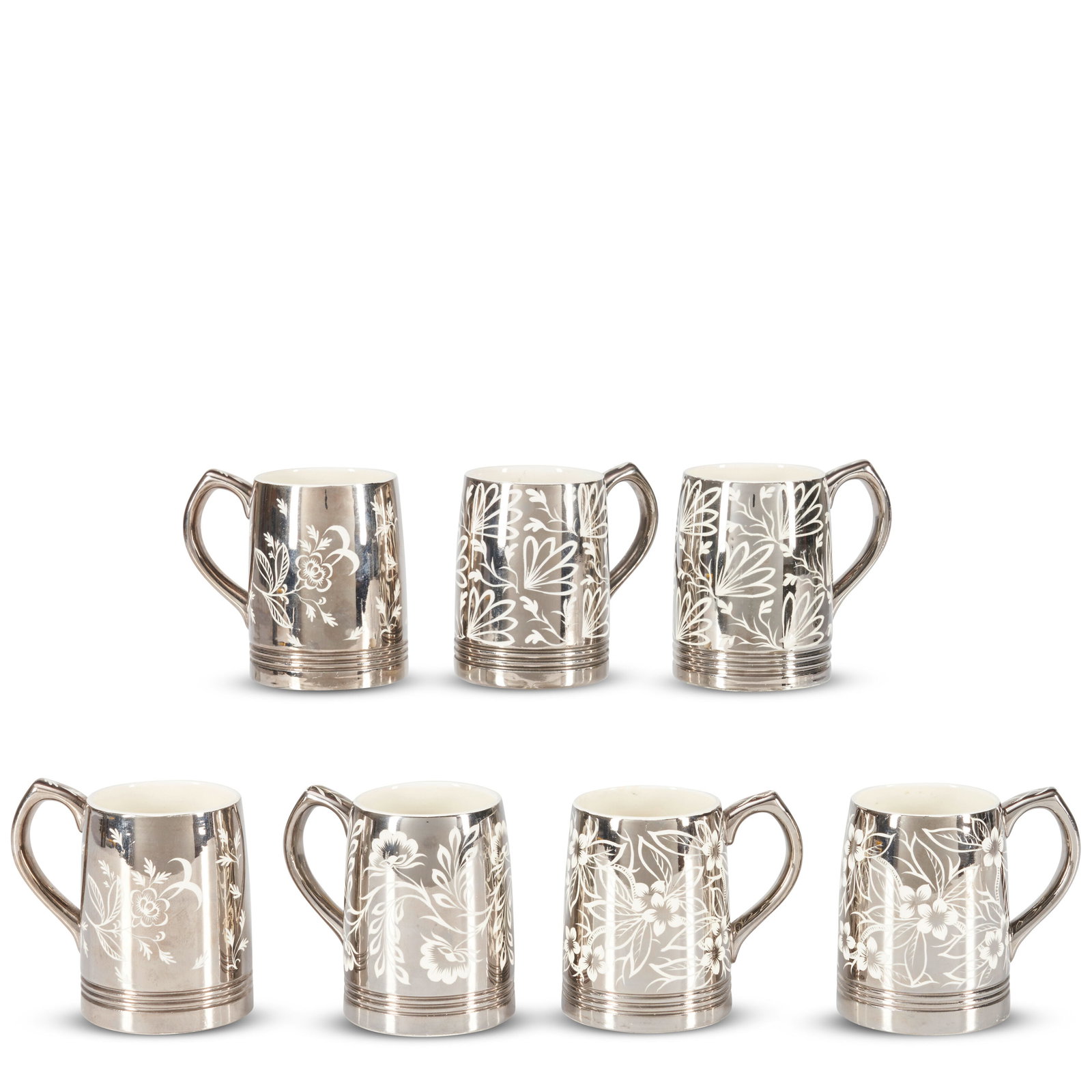 SEVEN WEDGWOOD KEITH MURRAY LUSTRE MUGS 20th century,: SEVEN WEDGWOOD KEITH MURRAY LUSTRE MUGS 20th century, each decorated with a floral motif, with printed marks, ht. 3 7/8 in. Footnotes: Property of Earl Buckman OVERALL CONDITION: Good, with minor surf