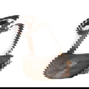 A RELIC REVOLUTIONARY WAR CARTRIDGE POUCH BELONGING TO SIMON FRY DATED 1776.: A RELIC REVOLUTIONARY WAR CARTRIDGE POUCH BELONGING TO SIMON FRY DATED 1776. The crescent shaped flap with cut initials 'DD' opening to a nineteen hole wood block, the 1 1/4 in. leather strap with