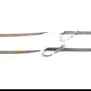 TWO 18TH CENTURY HANGERS.: TWO 18TH CENTURY HANGERS. A brass hilted hanger with a shell guard, wood grip and slightly curved single-edge blade; and a hanger with a silver hilt with a spiral carved and green dyed grip, silver