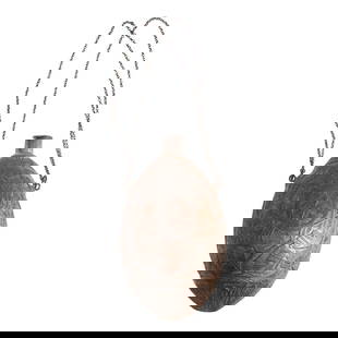 AN EARLY 19TH CENTURY CARVED COCONUT WITH NAVAL MOTIFS.: AN EARLY 19TH CENTURY CARVED COCONUT WITH NAVAL MOTIFS. The relief carving including three oval panels depicting a spread wing eagle within a wreath above a panoply of arms; a panel with intertwined