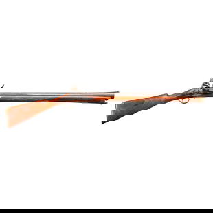 AN EARLY 19TH CENTURY ENGLISH FLINTLOCK BLUNDERBUSS.: AN EARLY 19TH CENTURY ENGLISH FLINTLOCK BLUNDERBUSS. 28 1/2 in., octagon to round barrel with flaring elongated muzzle and brass bushing at the vent; 1804 dated East India Company lock marked