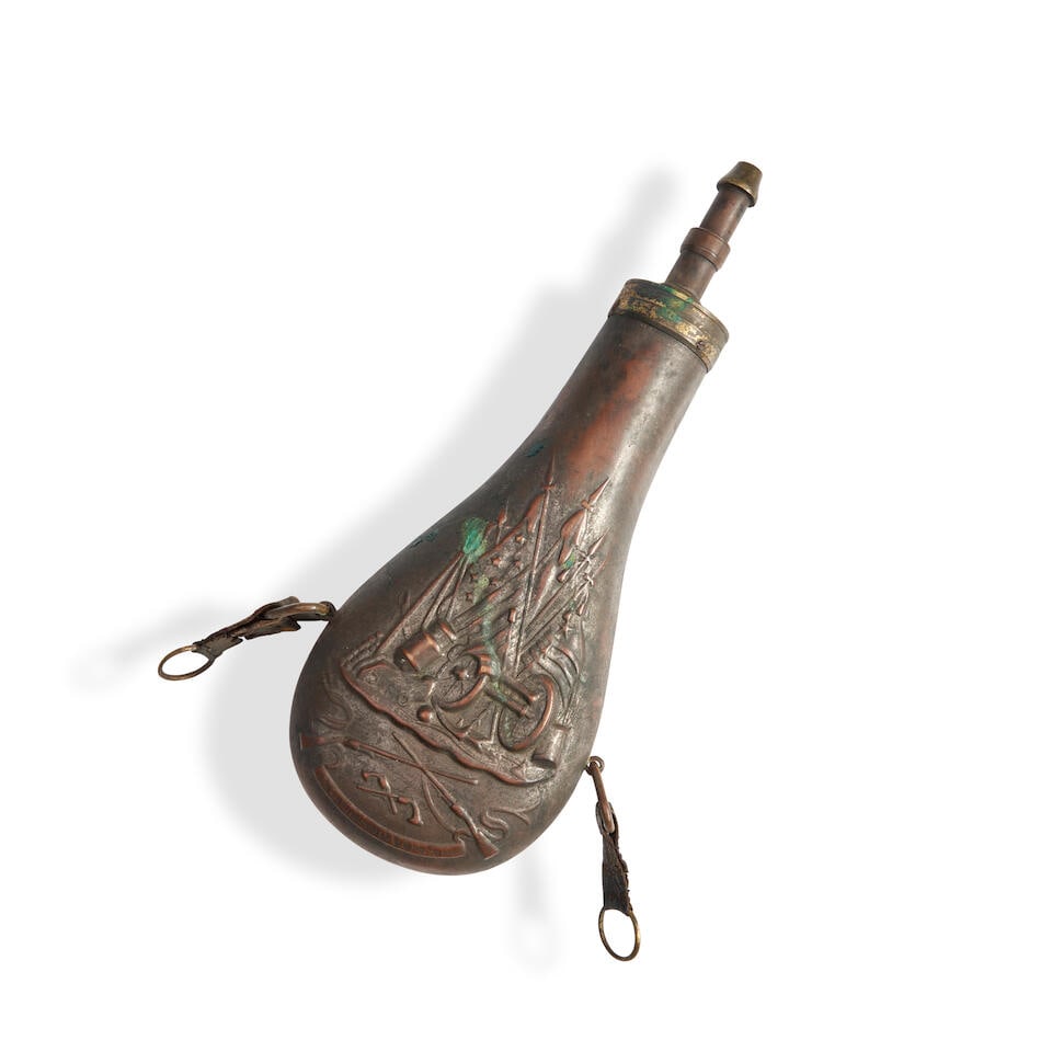 AN EMBOSSED COPPER COLT WALKER/DRAGOON POWDER FLASK,: AN EMBOSSED COPPER COLT WALKER/DRAGOON POWDER FLASK, mid-19th century. The flask with embossed Texas and United States flags above cannon, crossed rifles and pistols and a banner reading 'COLTS PATENT