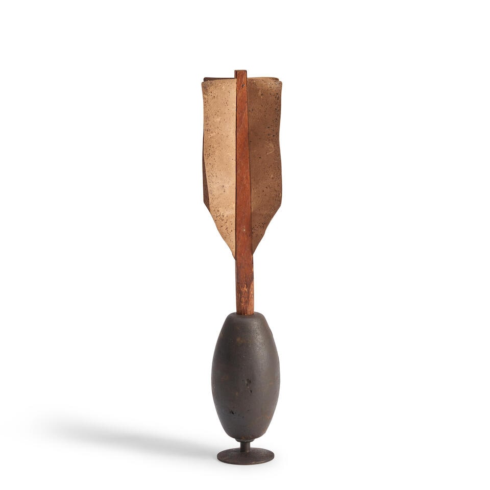 A CIVIL WAR THREE-POUND KETCHUM GRENADE.: A CIVIL WAR THREE-POUND KETCHUM GRENADE. The cast iron body with plunger at the base and original wood post and four paper fins. Overall ht. 13 3/4 in. For further information on this lot please visit