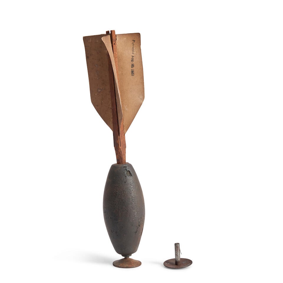 A CIVIL WAR FIVE-POUND KETCHUM GRENADE.: A CIVIL WAR FIVE-POUND KETCHUM GRENADE. The cast iron body with plunger at the base and original wood post and four paper fins marked 'Patented Aug. 20, 1861.' Overall ht. 16 in. For further informati
