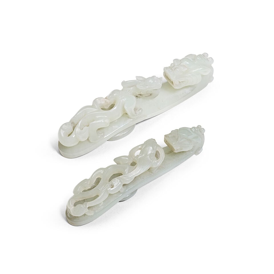 A WHITE JADE AND A PALE GREEN JADE 'CHILONG' BELT HOOK 19th century (2)