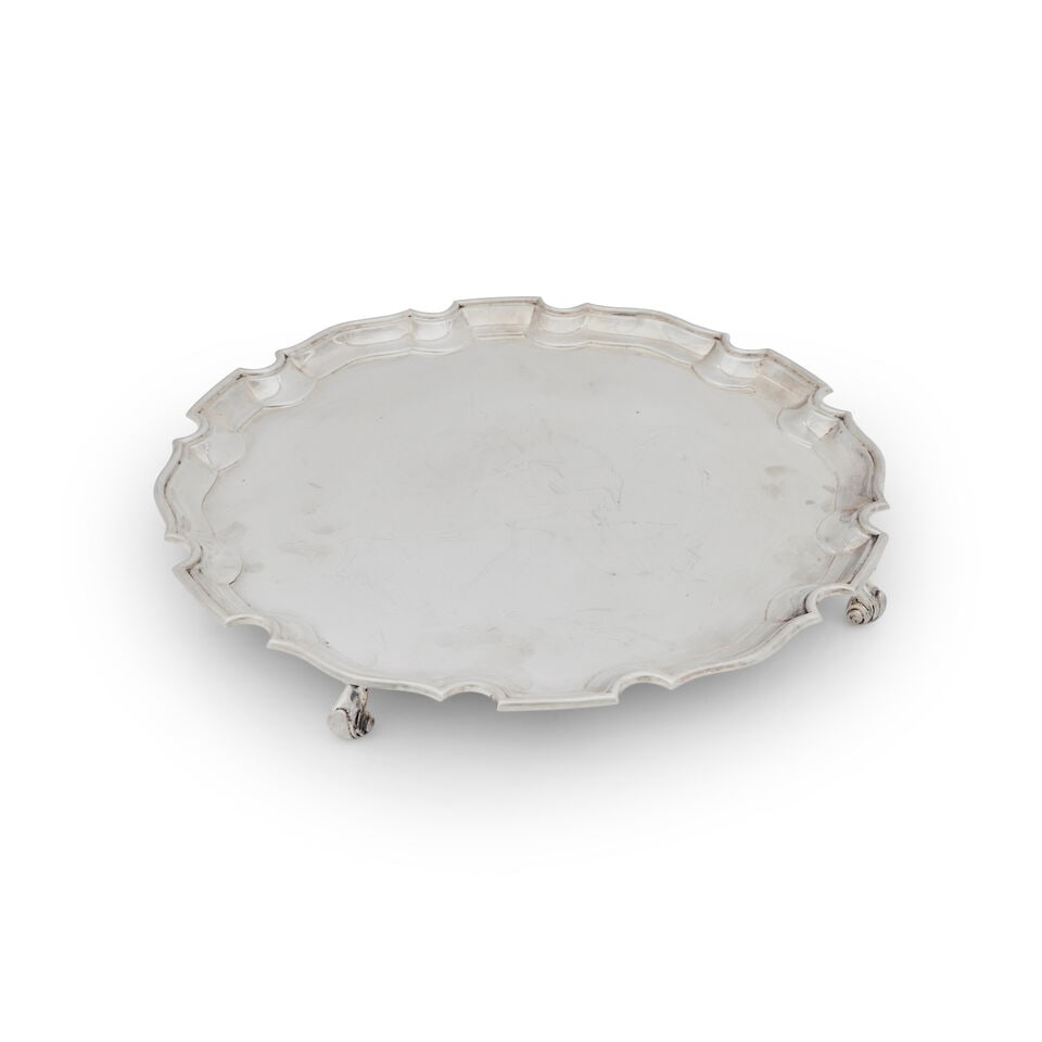 An Elizabeth II Silver Salver Roberts & Belk Ltd, Sheffield, 1969: An Elizabeth II Silver Salver Roberts & Belk Ltd, Sheffield, 1969 On four scroll feet and with shaped and moulded rim , diameter 36.3cm, weight 40oz. For further information on this lot please visit