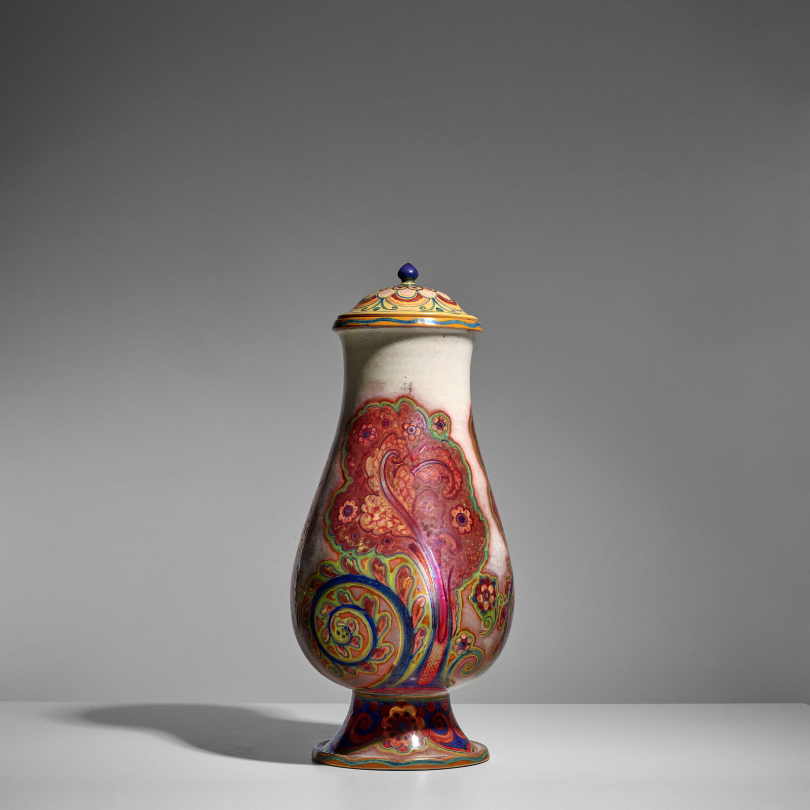 GALILEO CHINI (1873-1956) Vase and Coverexecuted 1919-30maiolica, painted marks 'CHINI E Co.. (M...: GALILEO CHINI (1873-1956) Vase and Cover executed 1919-30 maiolica, painted marks 'CHINI E Co.. (MUGELLO) ITALIA 405/2473' height 18 1/2in (47cm); diameter 8 1/2in (21.5cm) Footnotes: Literature Giann