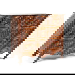 Commode arbalète en noyer, travail provincial du XVIIIe siècleA French provincial carv...: Commode arbalète en noyer, travail provincial du XVIIIe siècle A French provincial carved walnut commode, 18th century Of arc-en-arbalete form, the moulded top above three panelled long