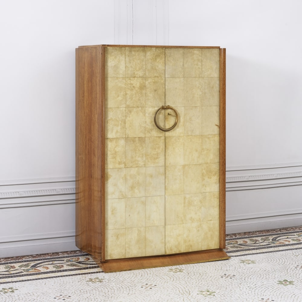 JEAN PASCAUD (1903-1996) Cabinet: JEAN PASCAUD (1903-1996) Cabinet Circa 1942-1946 Estampillé 'JEAN PASCAUD' et 'P' Sipo, parchemin et bronze patiné H: 160 cm. (63 in.); L: 109,5 cm. (43,11 in.); P: 54 cm. (21.1/4 in.) A sig