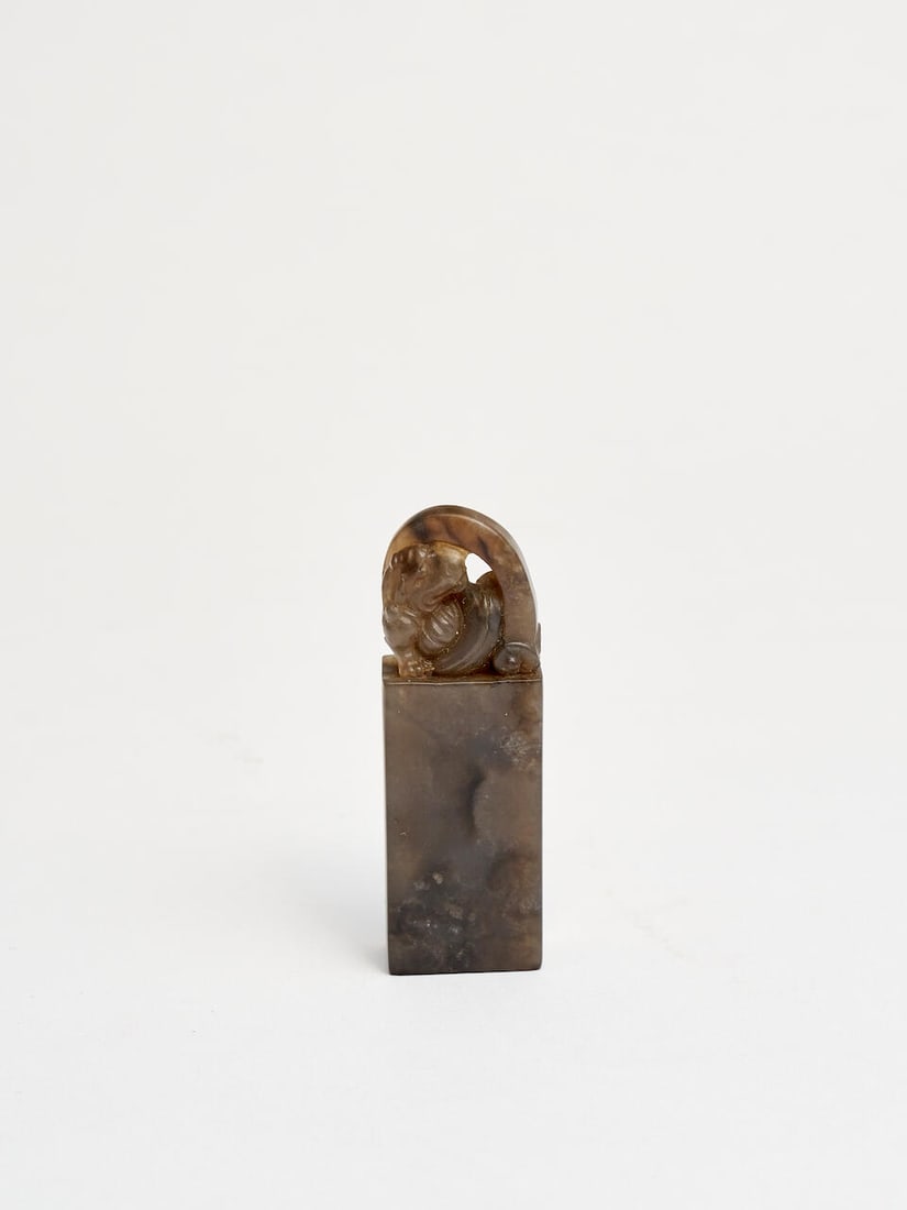 A soapstone 'lion' seal Early to mid 20th century: A soapstone 'lion' seal Early to mid 20th century with a box, 5.9cm high Footnotes: 二十世紀早至中期 壽山石獅紐料 &#